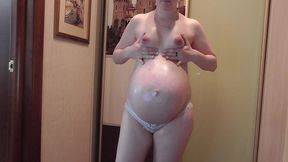 gorgeous pregnant anna massages her belly