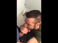 Hunk gives blowjob in a public restroom - amateur gay porn