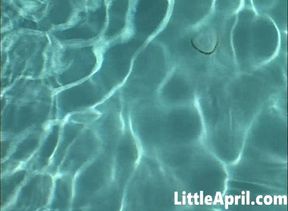Little April fingers herself in the pool in a POV solo