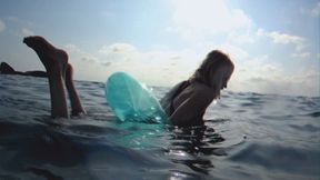 Alla swims in the sea with an inflatable transparent blue ring and wears a sports swimsuit, underwater shooting!!!