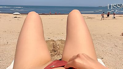 stranger fills my mouth on public beach