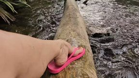 Milah Arches posing her Ipanema Flip Flops in the River