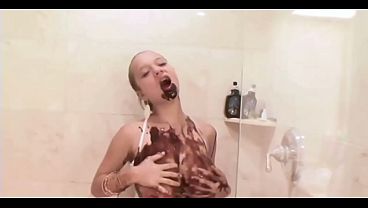 Busty Latina teen plays with chocolate sauce on her big natural tits
