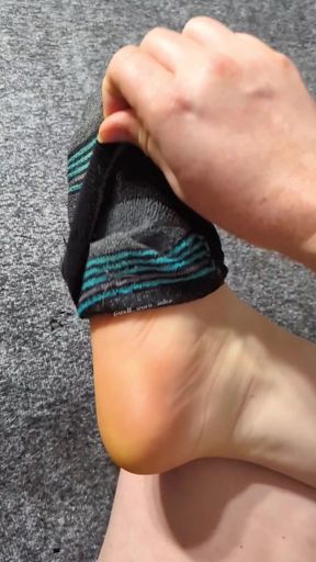 Sock-loving amateur shows off dirty feet