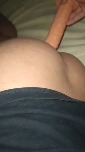 Playing with a dildo in my ass at night