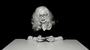 Vintage blonde granny in glasses reads exciting vintage sex book