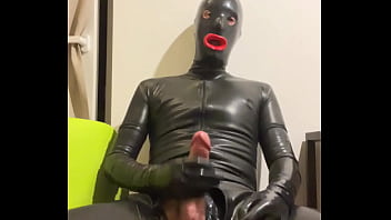 Rubberdoll with huge cock in total latex