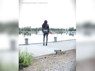 Walking in full leather outfit and heels.