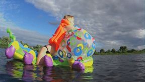 Alla rides a big rare inflatable caterpillar on the lake and blows away a big rare beach ball!!!