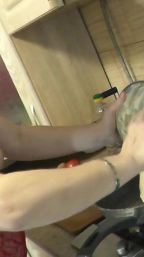 Emotional moment from &quot;Sexy MILF continues cooking in kitchen naked without panties and bra in red transparent negligee.&quot;