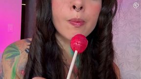 Curvy babe with split tongue licks lollipop then stuffs it in her hairy pussy