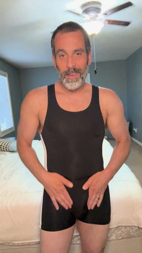 Caught flexing in a wrestling singlet, when my husband walks in, and I take his cock my way