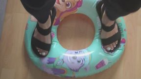 Stomping on a Swim Ring in Sandals
