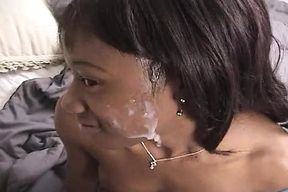 Pretty ebony gal gives nice head and gets a facial