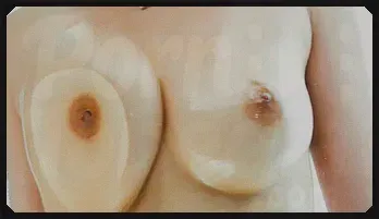 Anne poses with her wet t short before pulling her tits out