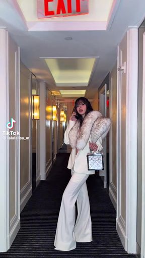 Woman in fur coat and white boots