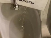 Destructive pissing in public urinal