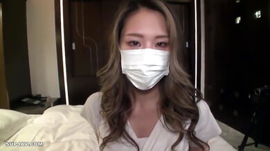 Japanese beauty in a face mask teases in silver heels before deep oral and passionate sex
