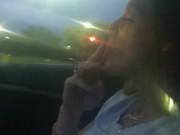 Milf smoking cigarettes while in passenger seat in vehicle