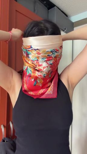 Woman with bandana over mouth
