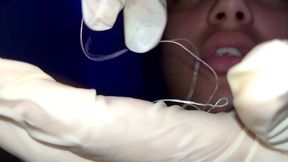 Trying to Use Dental Floss (close-up)