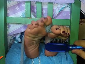 Ticklish feet in the tickle chair
