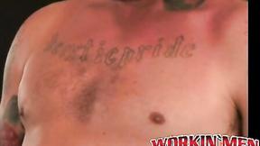 ”Inked dude tugging on his meat until he cums on his belly”