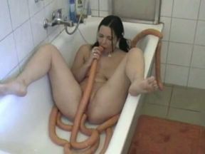 Crazy amateur bitch plays with a very long toy in the bathroom