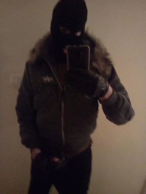 Jerking in mask and bomber jacket