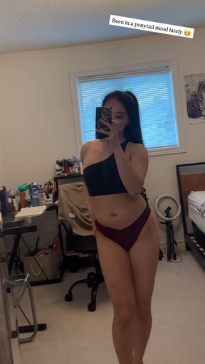 Woman in black bra and bikini bottoms