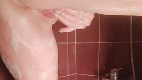 Having fun in the shower with a soapy finger fuck