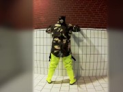 Pawing off in camo painter's overall and hi-viz waders