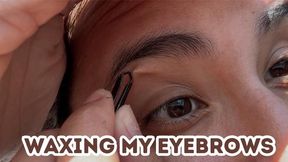 Waxing my eyebrows.