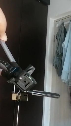 Amateur woman has fun trying on clothes and cutting them. Amateur woman vacuums naked in the house.   Clip 1