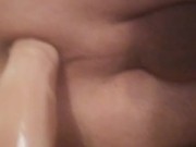 Riding 7 inch dildo on the bed