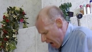 Dark haired German slut gets destroyed by two hard cock in the bathroom