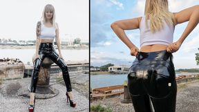 Anastasia walking outdoors in her creaky pvc leggings