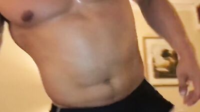 Strong dude is flexing muscles and showing his rock hard cock