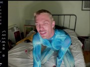 male camming model seducing viewer in his blue bedazzled superhero bodysuit (lol no homo)