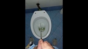 a youthfull man went into a filthy public rest room to piss and jack off