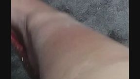 Ruby red, barely hanging on, one dangle away from magic