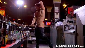Buff stud strips nude to masturbate passionately behind bar