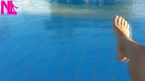 Barefoot Dangling in Swimming Pool Water