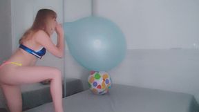 Alla wears an inflatable vest and plays with a beach ball and does a 16" balloon B2P!!!