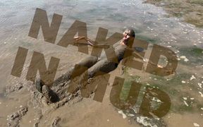Estuary mud girl playing in the nude