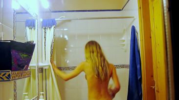 Long-haired brat naked in the bathroom