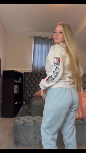 Blonde woman in sweatpants