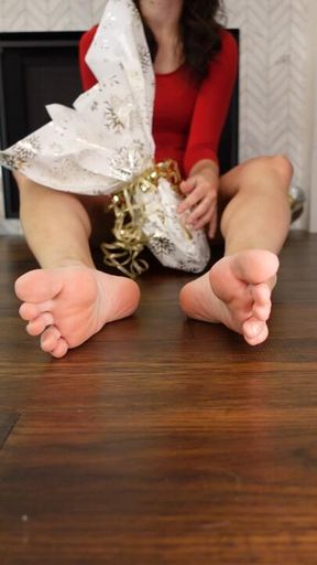 Unwrapping a Christmas gift with my feet