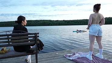Two beautiful girls share one big cock on the dock after SUP session