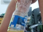 Pissing in the empty bottle like a champ